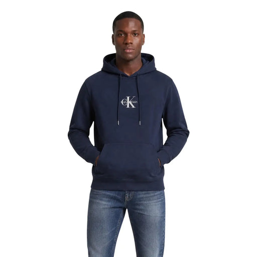 Navy blue calvin klein jeans men cotton sweatshirt with white logo and drawstrings front view hoodie design