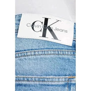Calvin Klein Jeans label stitched onto premium denim fabric for men’s jeans