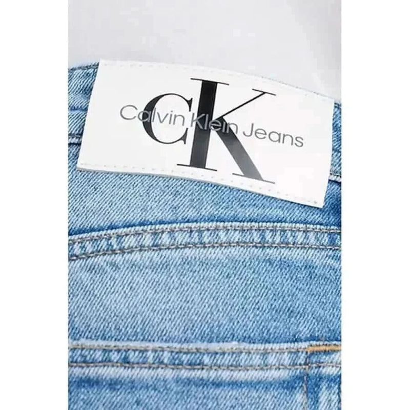 Calvin Klein Jeans label stitched onto premium denim fabric for men’s jeans