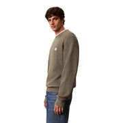 Calvin Klein Jeans Pull homme en maille gaufrée de coton vert olive avec petit logo blanc sur la poitrine