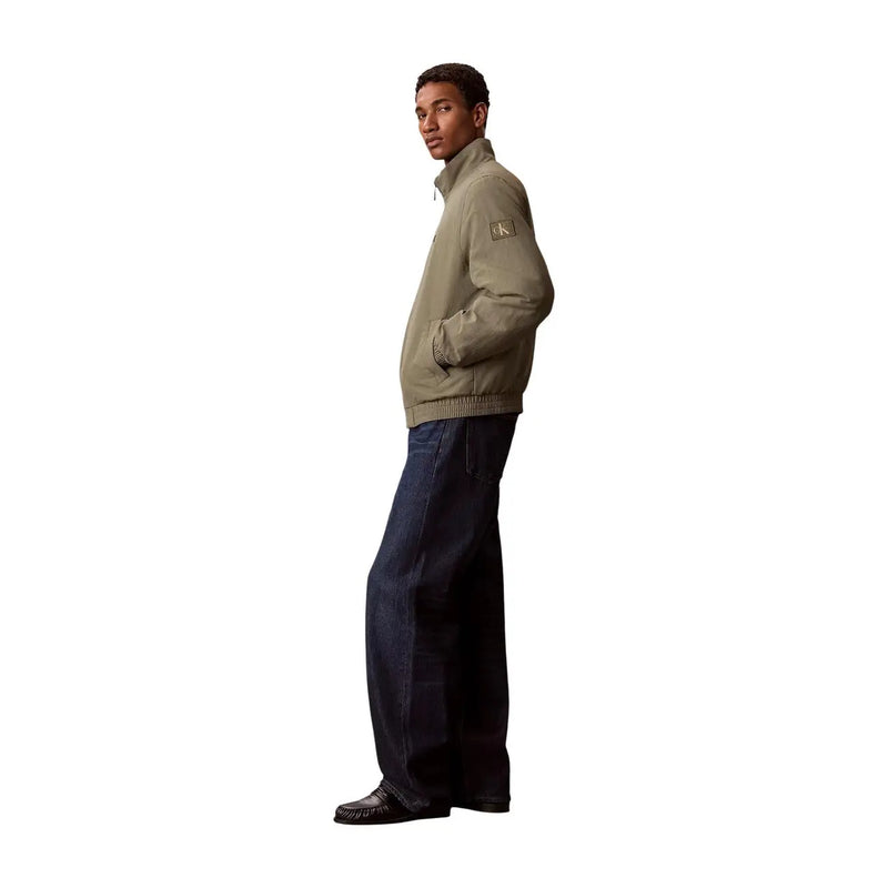 Calvin Klein Jeans men green nylon blazer turtleneck with a khaki zip-up bomber jacket featuring ribbed hem and cuffs