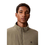 Calvin Klein Jeans men green nylon blazer featuring an olive green zip-up jacket with embroidered logo on chest