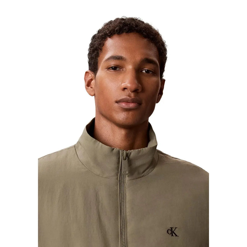 Calvin Klein Jeans men green nylon blazer featuring an olive green zip-up jacket with embroidered logo on chest