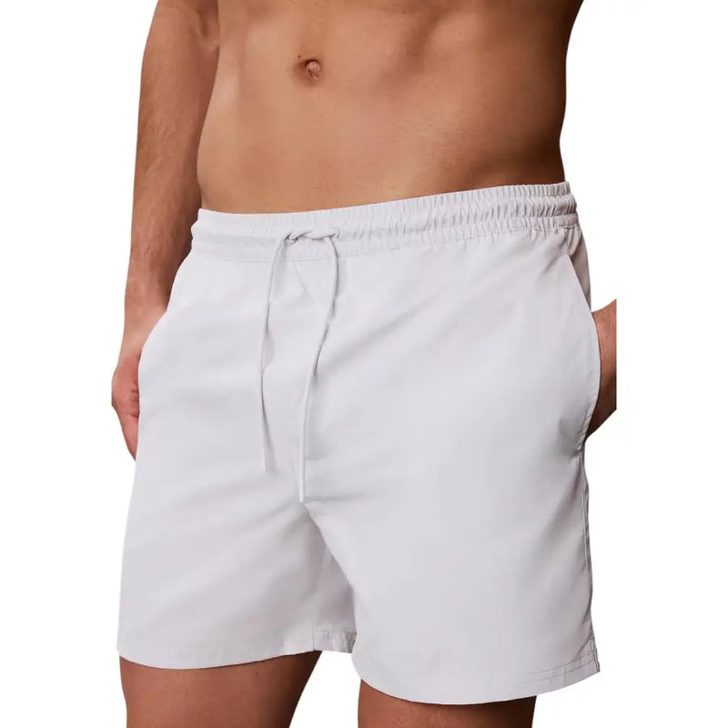 Calvin Klein Jeans men grey medium swimwear featuring lightweight swim trunks with elastic waistband and drawstring
