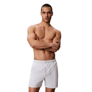 Calvin Klein Jeans men grey medium drawstring swimwear shown as white athletic shorts with elastic waistband and drawstring
