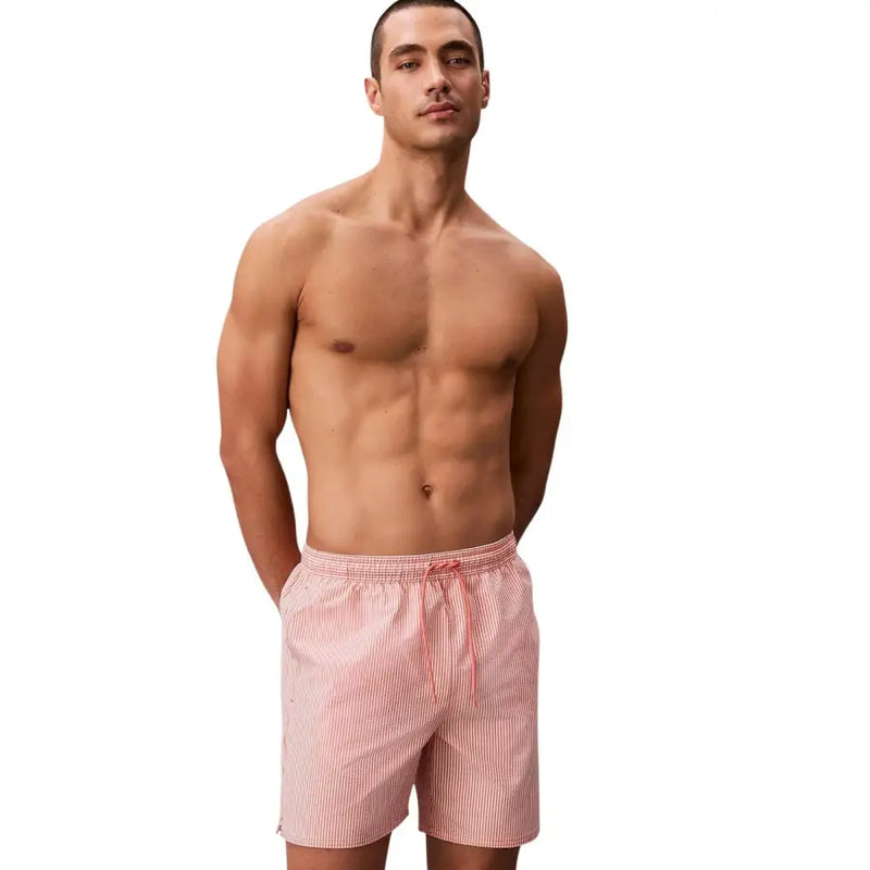 Calvin Klein Jeans men grey medium drawstring swimwear featuring pink and white striped swim trunks with waistband