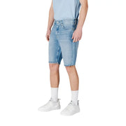 Light blue denim shorts with white socks and sneakers.