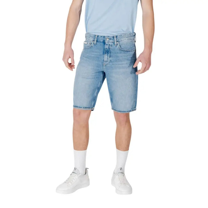 Light blue denim shorts with a faded wash and rolled hem, designed by levi’s.