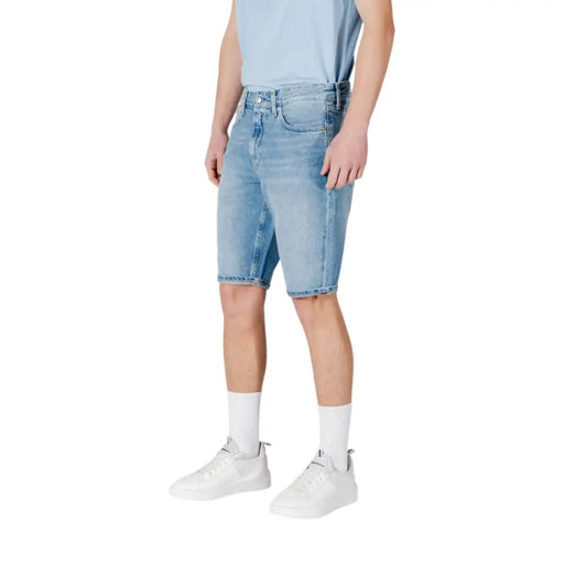 Calvin Klein Jeans men light blue cotton shorts in light-wash denim with classic five-pocket design and frayed hem