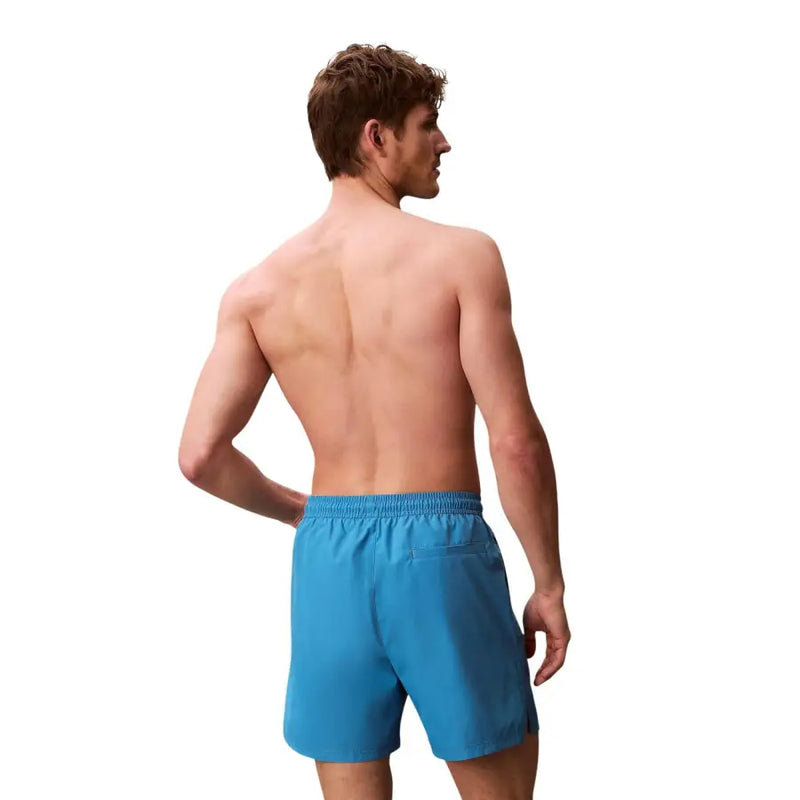 Calvin Klein Jeans Short de bain homme bleu clair en polyester avec taille élastique et petite poche latérale