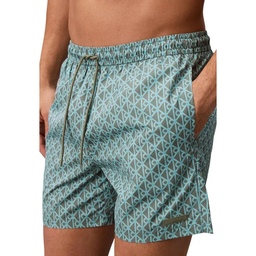 Calvin Klein Jeans men light blue polyester swim shorts featuring gray trunks with light blue geometric pattern and olive drawstring