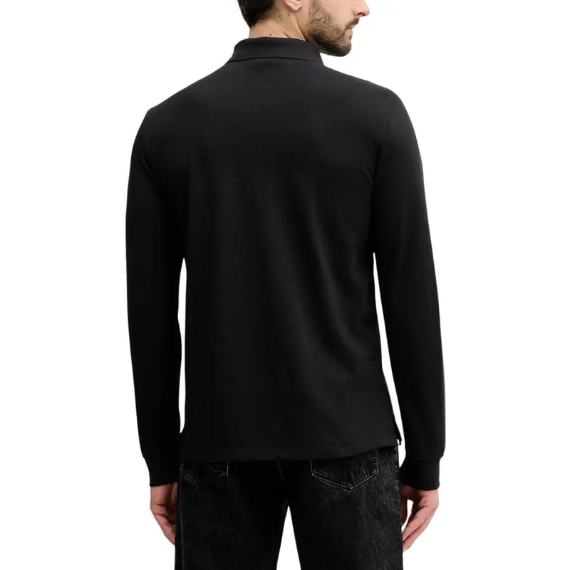 Polo noir en coton à manches longues, col classique et poignets côtelés de Calvin Klein Jeans polo homme manches longues