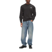 Calvin Klein Jeans Sweat-shirt noir en coton à col rond et manches longues pour homme, orné d'un petit logo blanc sur la poitrine.
