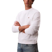 Calvin Klein Sweat-shirt blanc en coton à col rond pour homme, orné d'un petit logo rouge brodé sur la poitrine gauche.