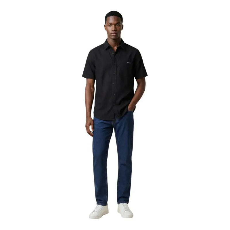 Calvin Klein Jeans Chemise noire à manches courtes pour homme, boutonnée, avec logo brodé discret sur la poitrine