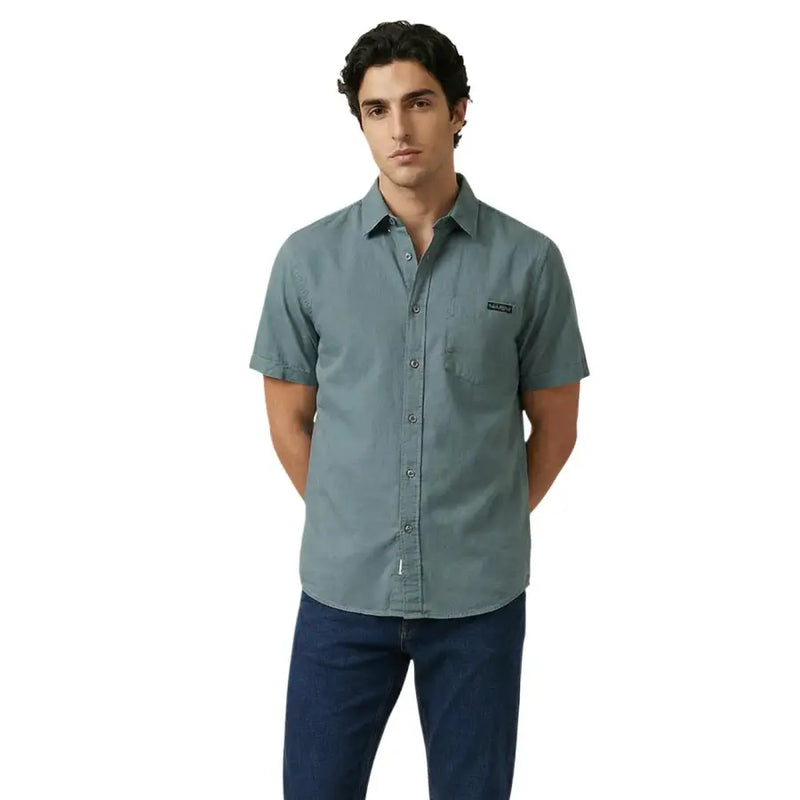 Calvin Klein Jeans Chemise homme en coton bleu sarcelle discret, à la texture subtile, avec poche poitrine gauche, manches courtes et boutons.