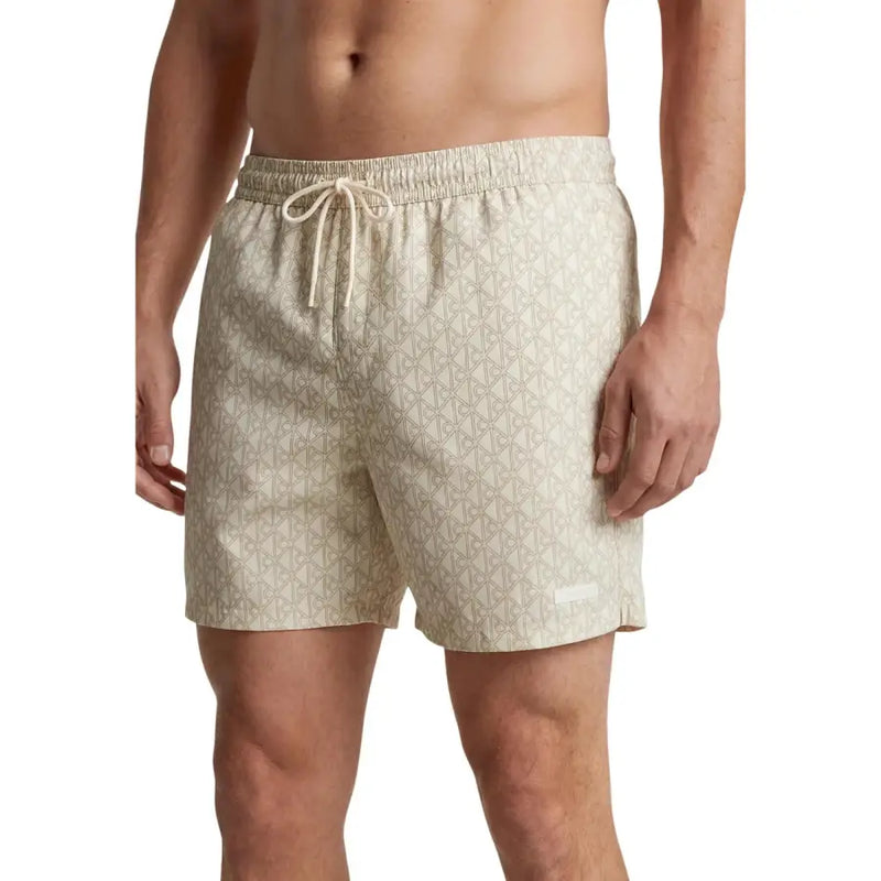 Calvin Klein Jeans men swimwear beige swim trunks with subtle geometric pattern and matching drawstring waistband