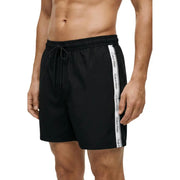 Black Calvin Klein Jeans men swim trunks with white side stripe featuring repeating brand logo for swimwear use