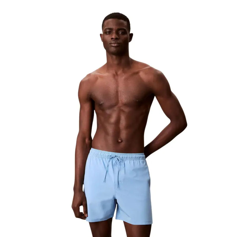 Calvin Klein Jeans men swimwear light blue swim trunks with drawstring waistband for comfortable fit
