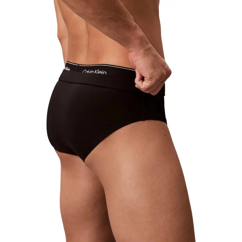 Calvin Klein Jeans men swimwear black briefs with white logo band designed for comfortable beach use