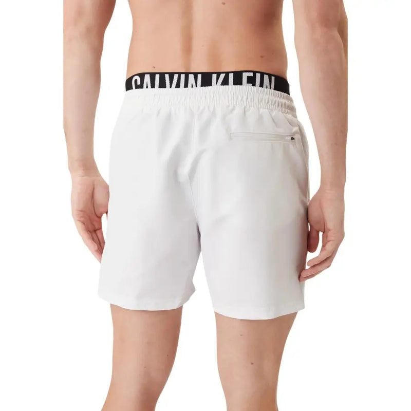 White Calvin Klein Jeans men swimwear swim trunks with black elastic waistband and white logo lettering