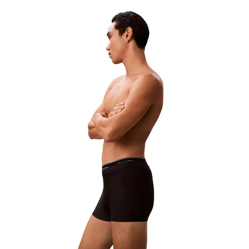 Black Calvin Klein Jeans men swimwear boxer briefs with a subtle white logo on the waistband