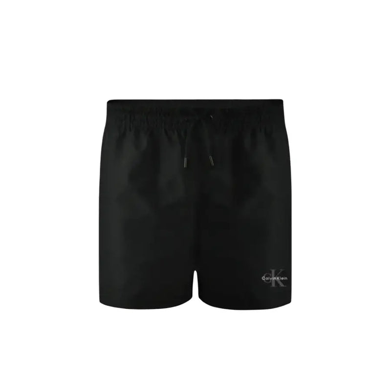Calvin Klein Jeans men swimwear black swim trunks with subtle embroidered logo on lower right leg for beach use
