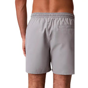 Back side of gray Calvin Klein Jeans men swimwear shorts with elastic waistband and single back pocket