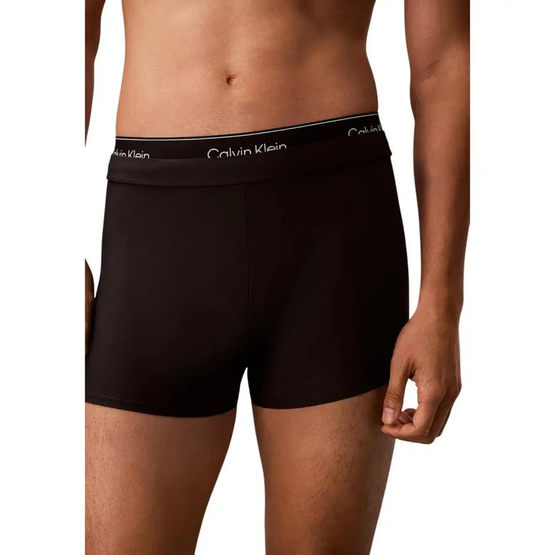 Black Calvin Klein Jeans men swimwear boxer briefs with white logo waistband designed for swimming comfort