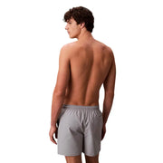 Calvin Klein Jeans men swimwear gray athletic shorts with elastic waistband and side pocket for comfortable wear