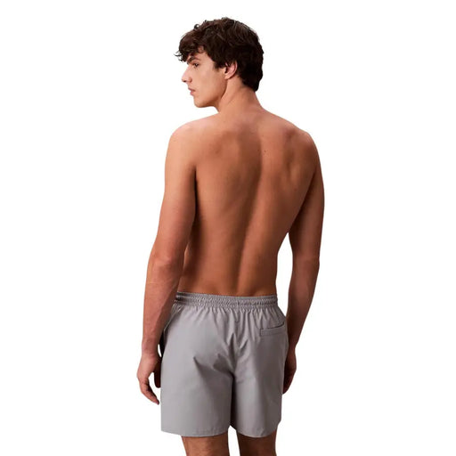 Calvin Klein Jeans men swimwear gray athletic shorts with elastic waistband and side pocket for comfortable wear