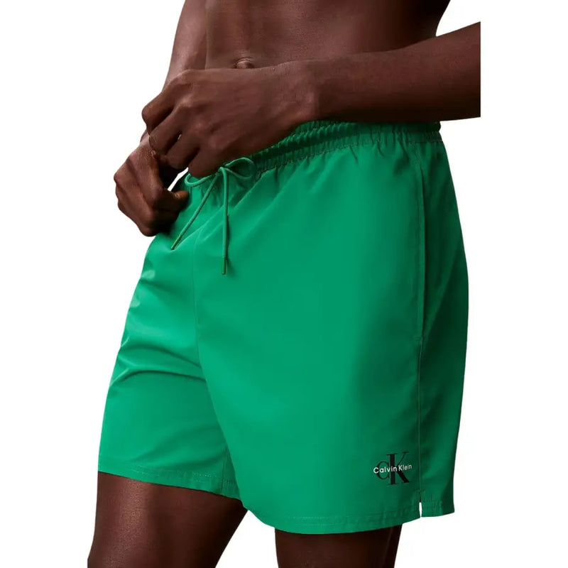 Vibrant green Calvin Klein Jeans men swimwear with drawstring waistband and subtle logo on lower leg