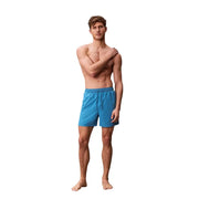 Calvin Klein Jeans men swimwear bright blue swim trunks with drawstring waistband designed for beachwear