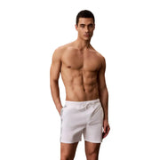 White Calvin Klein Jeans men swimwear swim trunks with subtle side stripe detail for casual beachwear
