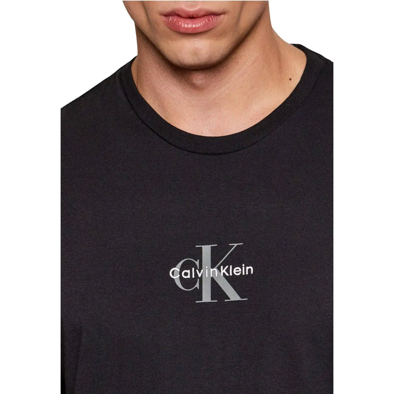 Calvin Klein Jeans men t-shirt in black featuring a subtle silver ck logo and brand name centered on the chest