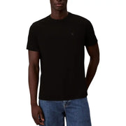 T-shirt noir à manches courtes et col rond en coton t-shirt avec un petit logo brodé sur la poitrine gauche par Calvin Klein Jeans