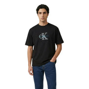 Noir Calvin Klein Jeans hommes t-shirt avec un logo CK brodé bien visible en turquoise et des détails argentés