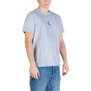 Light blue Calvin Klein Jeans men t shirt with small embroidered logo on left chest made of cotton with round neck
