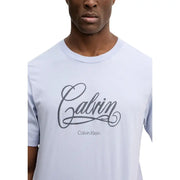 Light blue cotton Calvin Klein Jeans men t-shirt with dark gray cursive Calvin logo and round neck in size S