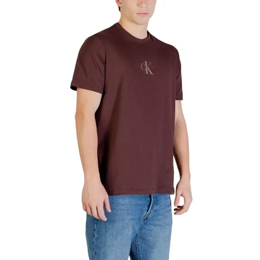 A maroon calvin klein jeans men t shirt made of brown print cotton with a subtle embroidered logo on the chest
