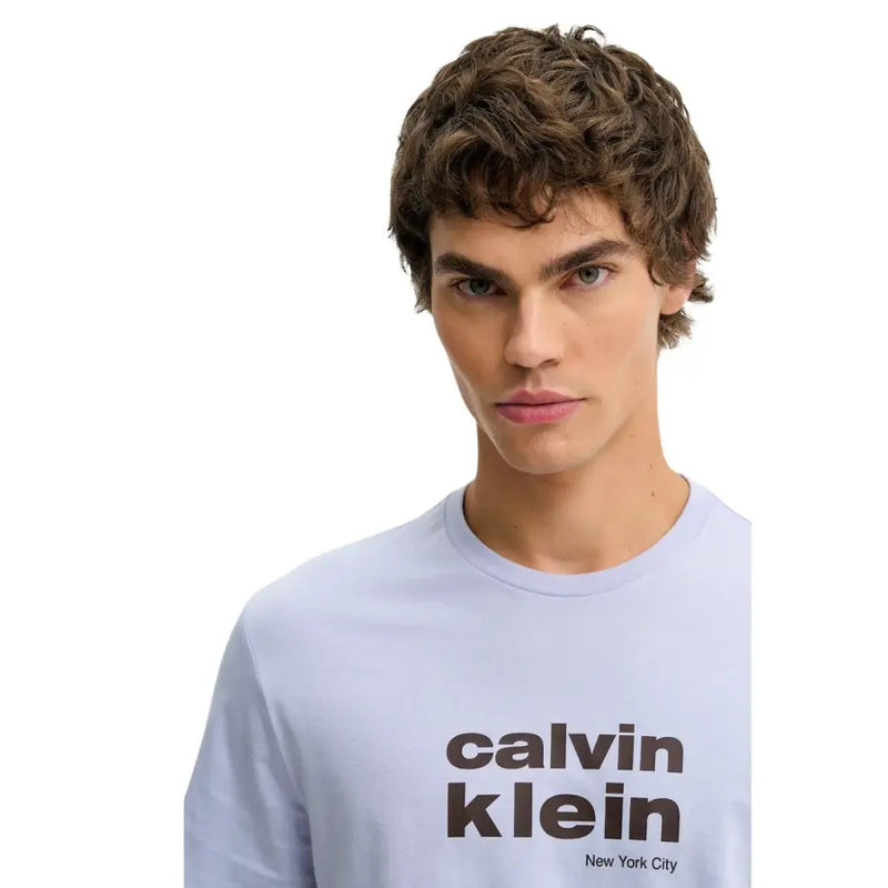 Light blue calvin klein jeans men long-sleeve cotton t shirt with bold black logo and new york city text print