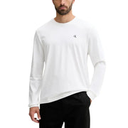 T-shirt blanc à manches longues et col rond en coton t-shirt avec un petit logo CK noir sur la poitrine gauche par Calvin Klein Jeans