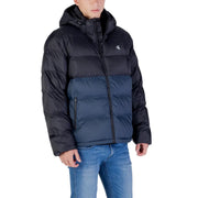 Calvin Klein Jeans Doudoune homme noire et bleu marine à capuche matelassée, vue de face