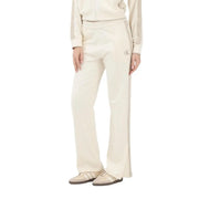 Calvin Klein Jeans Pantalon en coton beige pour femme, comprenant un pantalon de survêtement couleur crème avec fente latérale et logo brodé