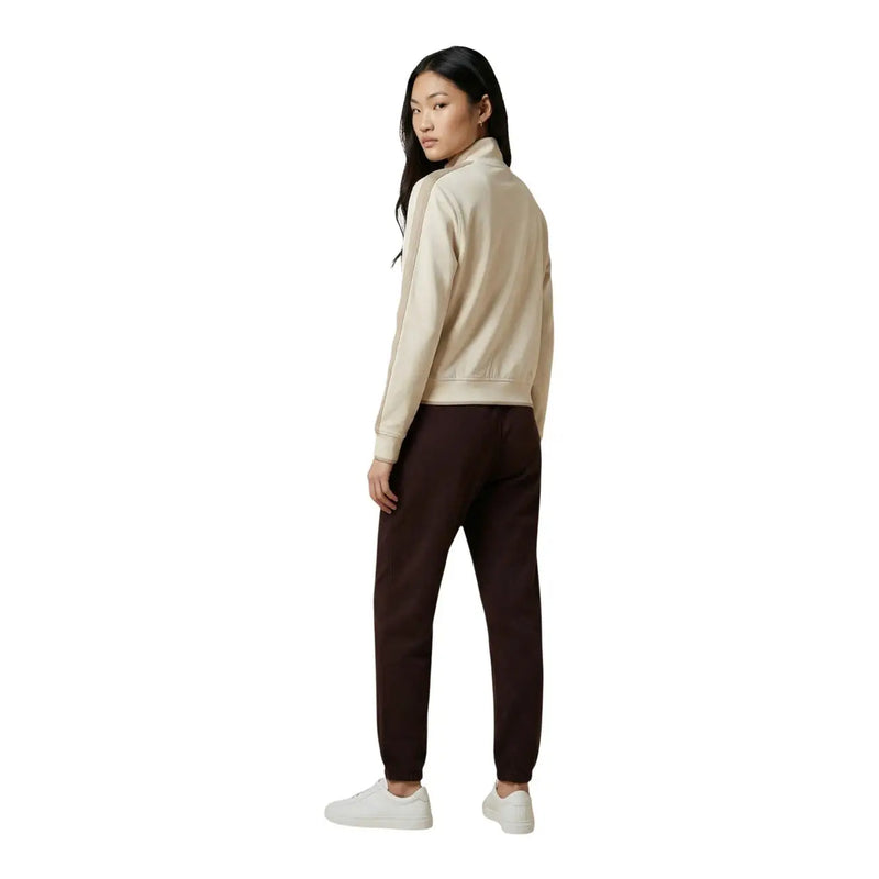 Calvin Klein Jeans women beige cotton blend bomber jacket with ribbed cuffs and hem paired with dark brown joggers