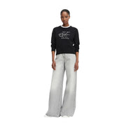 Pull en maille de coton noir par Calvin Klein Jeans avec un col orné de perles et un logo brodé blanc