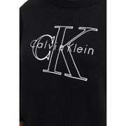 Pull en maille de coton noir Calvin Klein pour femme, orné d'un logo CK brodé en blanc sur le devant.
