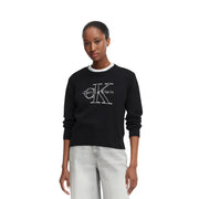 Calvin Klein Jeans Pull en maille de coton noir pour femme, orné d'un logo brodé blanc et d'une bordure nacrée au col.