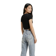 Light-wash denim jeans with classic five-pocket design and subtle fading paired with calvin klein black cotton t shirt