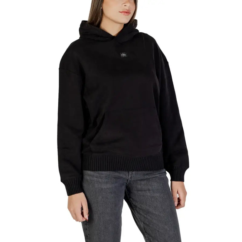 Calvin Klein Jeans women black hooded sweatshirt with ribbed cuffs and hem and a small embroidered logo on chest